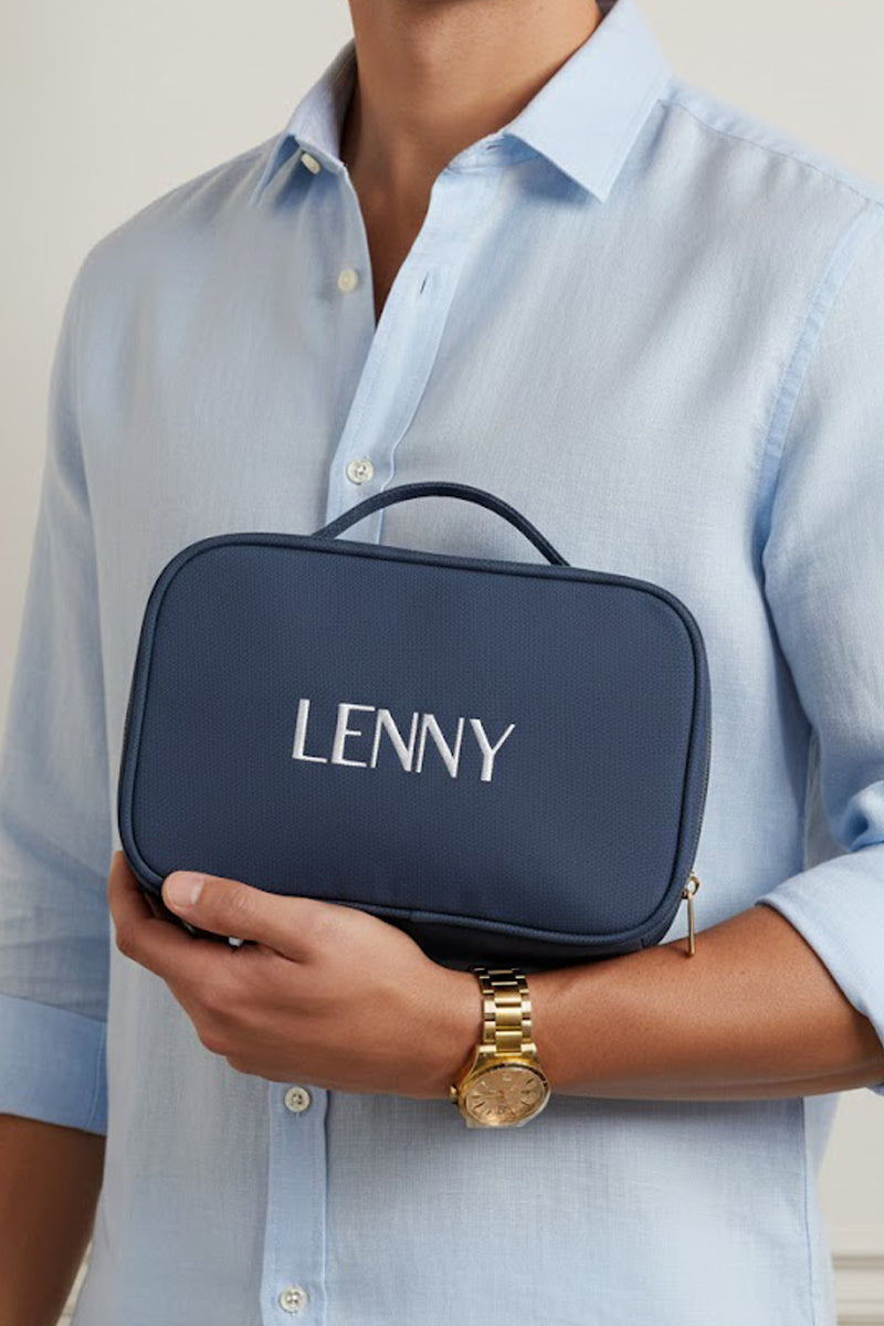 Navy vanity being held by a male