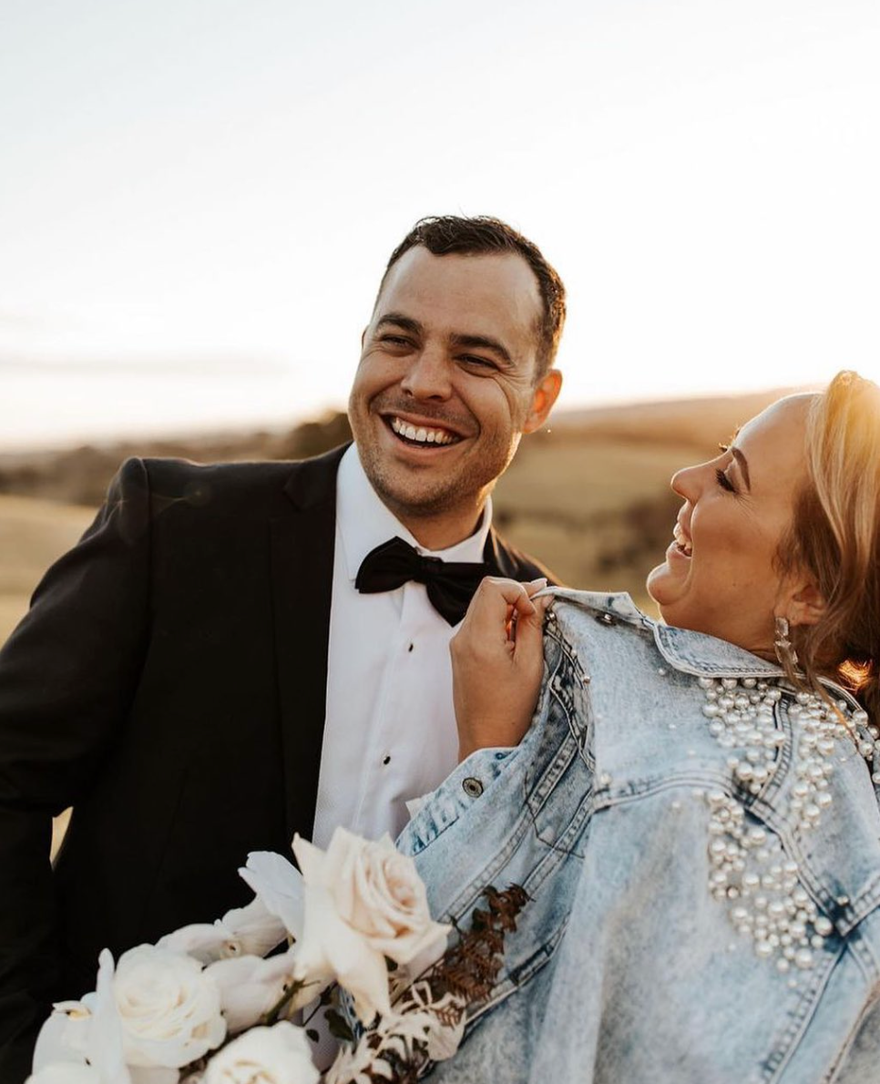 Bride wearing personalised pearl jacket on her wedding day